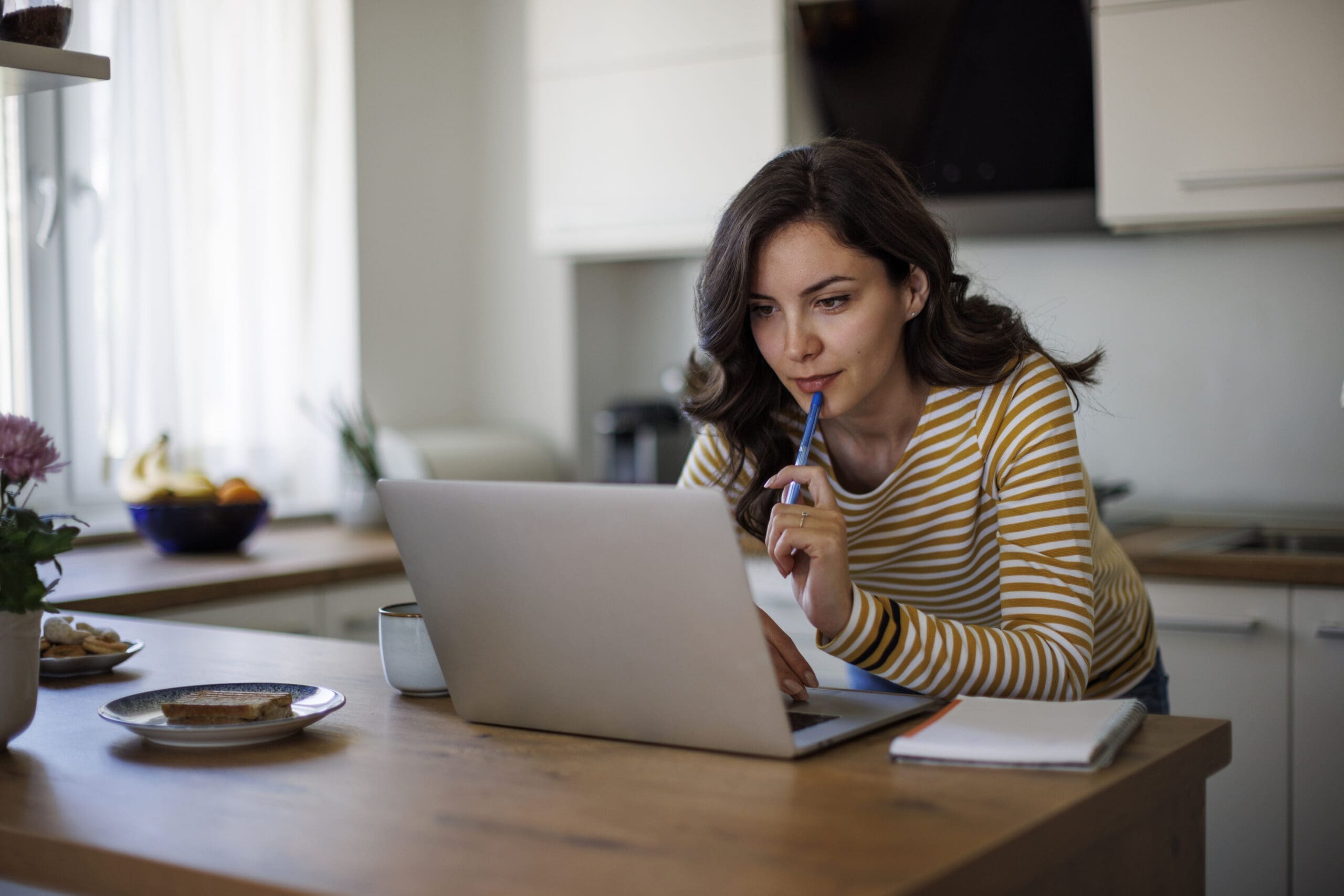 Young woman using a laptop while at home
